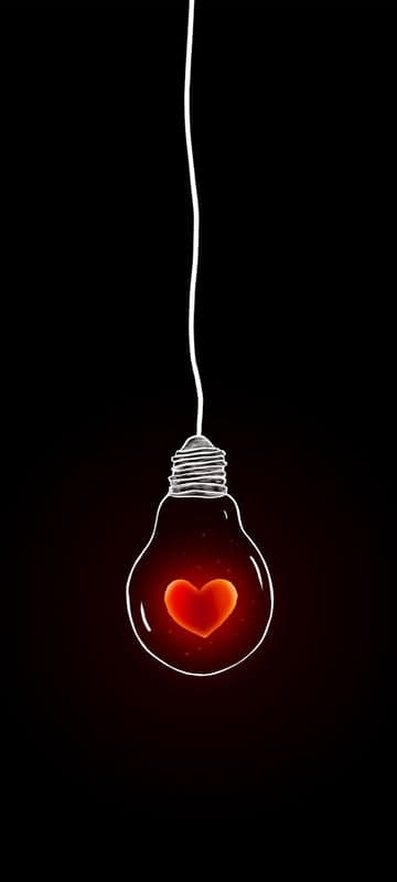 Glowing Heart Inside Light Bulb Silhouette