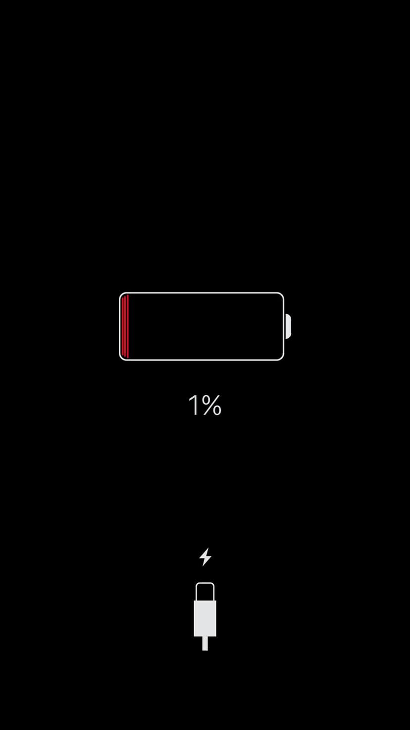 Low battery icon showing one percent power with a white lightning bolt symbol over a solid black background.