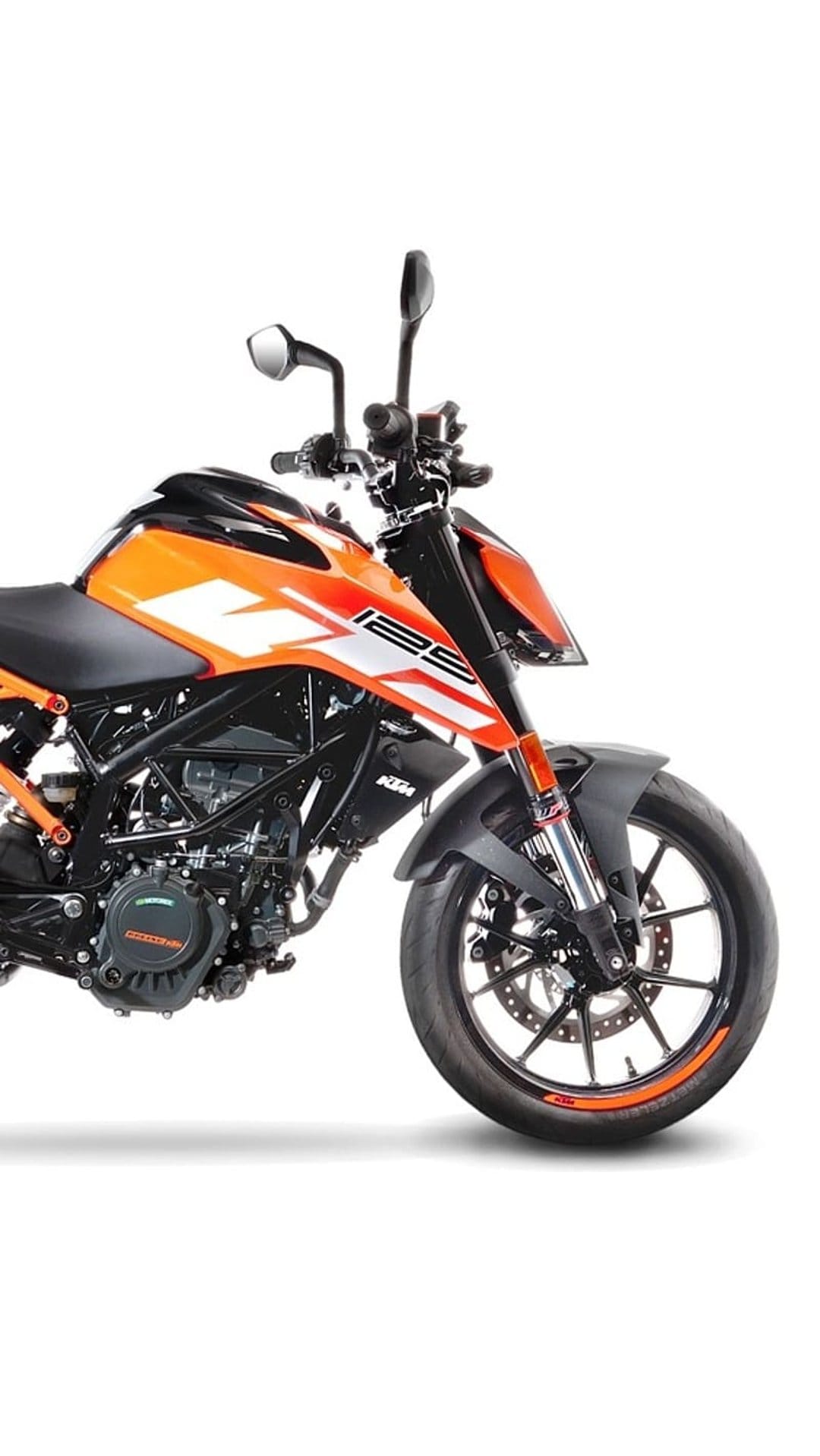 KTM 125 Duke motorcycle in profile showing an orange trellis frame, black engine parts, and alloy wheels.