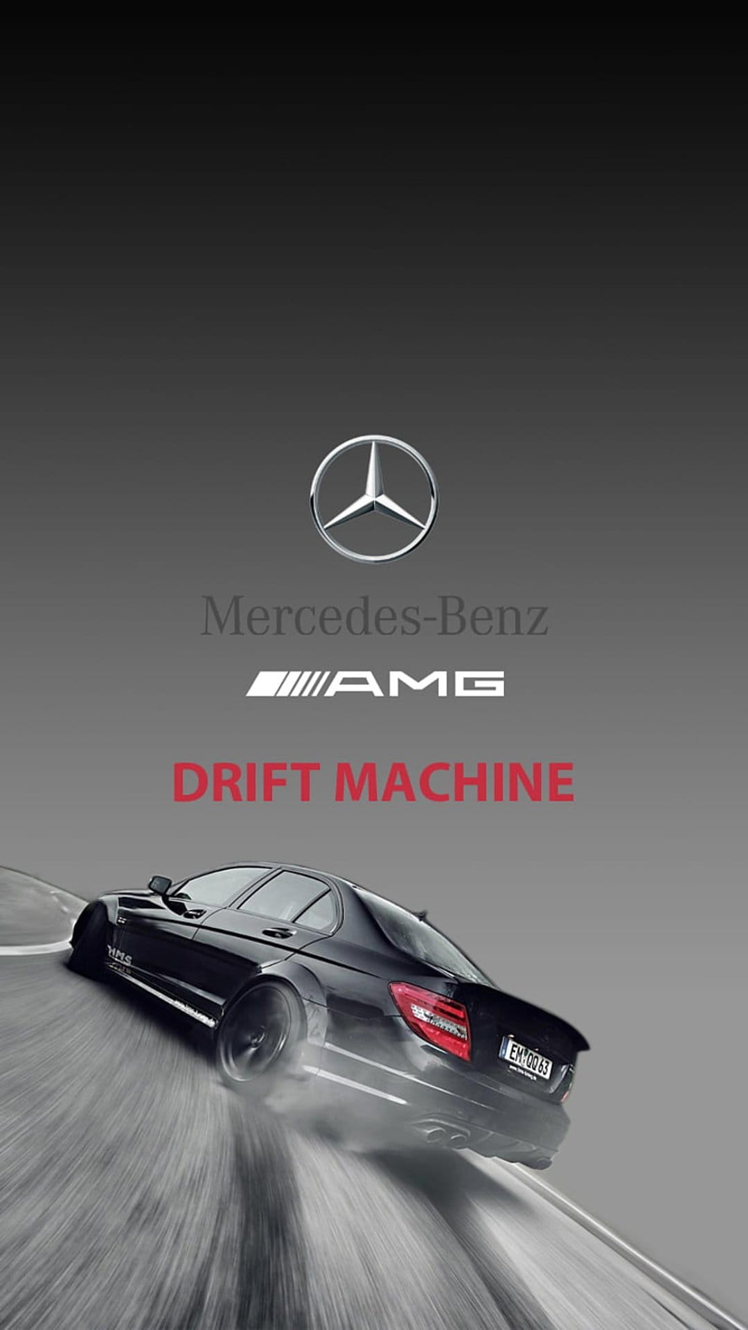 Black Mercedes-Benz C63 AMG drifting sideways with white tire smoke and motion blur on a dark asphalt track.