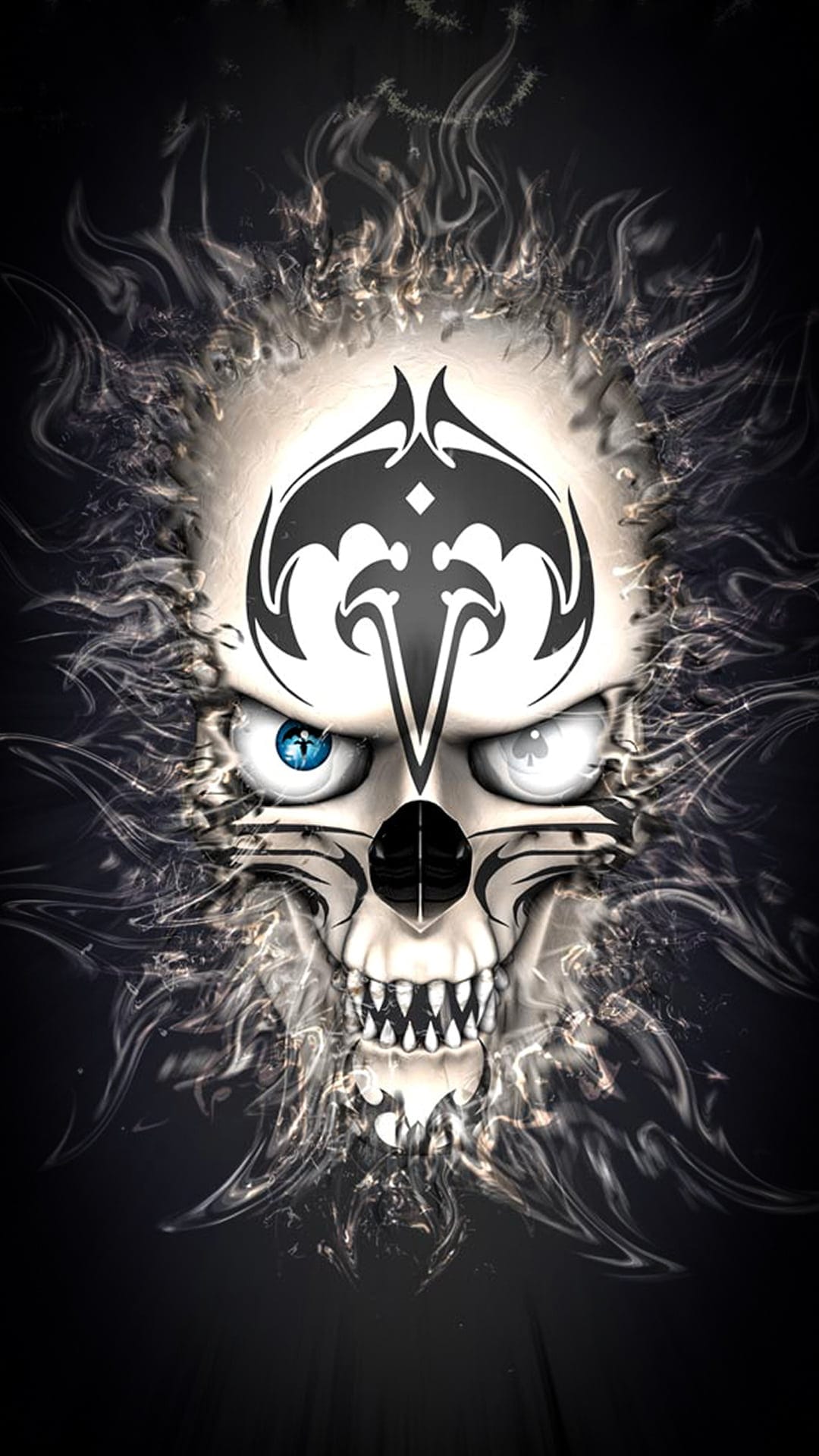 Human skull with black tribal tattoos and mismatched glowing eyes surrounded by wisps of white smoke and mist.