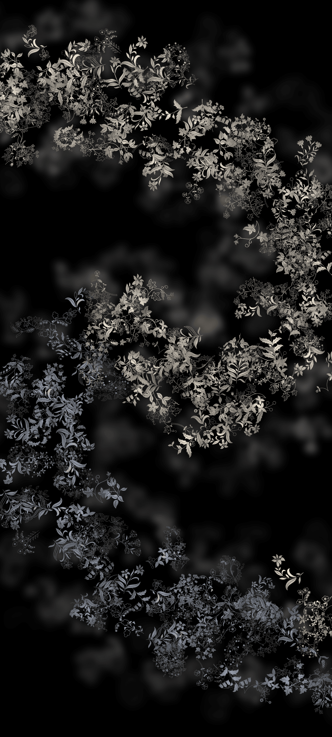 White floral vines and small leaves cascade over a dark background with soft bokeh highlights and vertical depth.