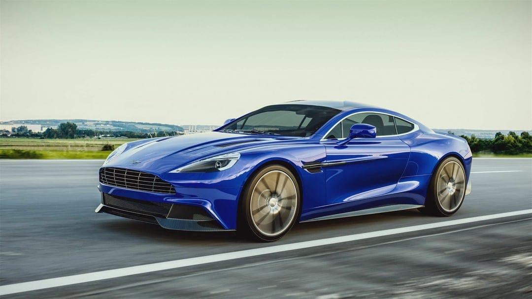 Blue sports car driving fast on a highway with motion blurred wheels and green hills in the distant background.