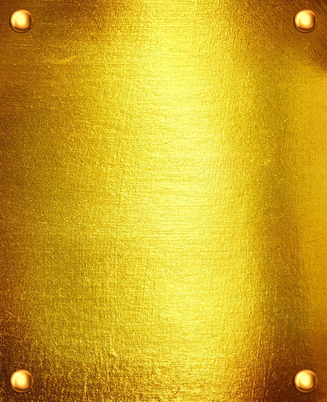 Gold coins rest on a textured yellow metallic surface with glossy reflections and high resolution detail.