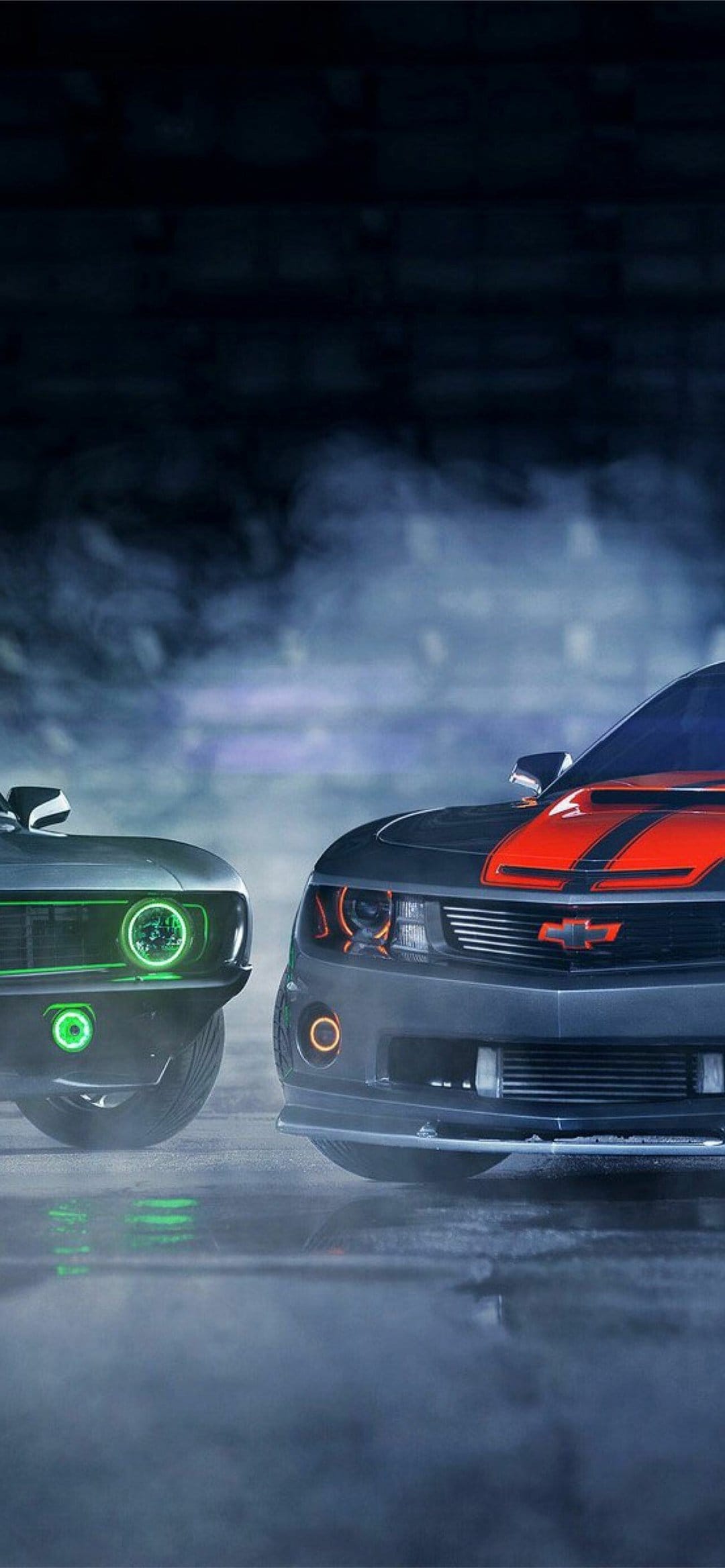 Classic and modern Chevrolet Camaros glowing with green and orange lights amidst thick atmospheric smoke and mist.
