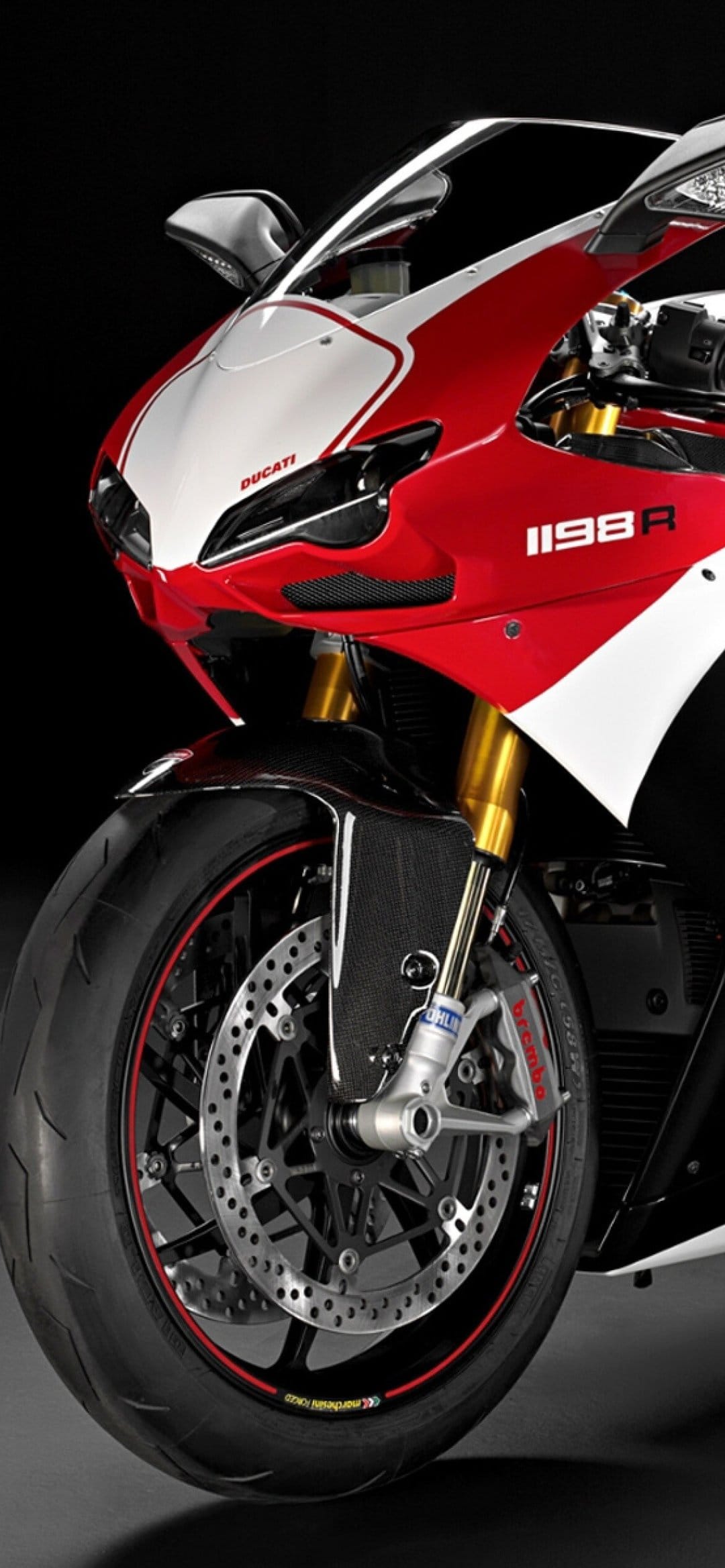 Ducati 1198R front view with red and white fairing, gold forks, and carbon fiber fender on black background.