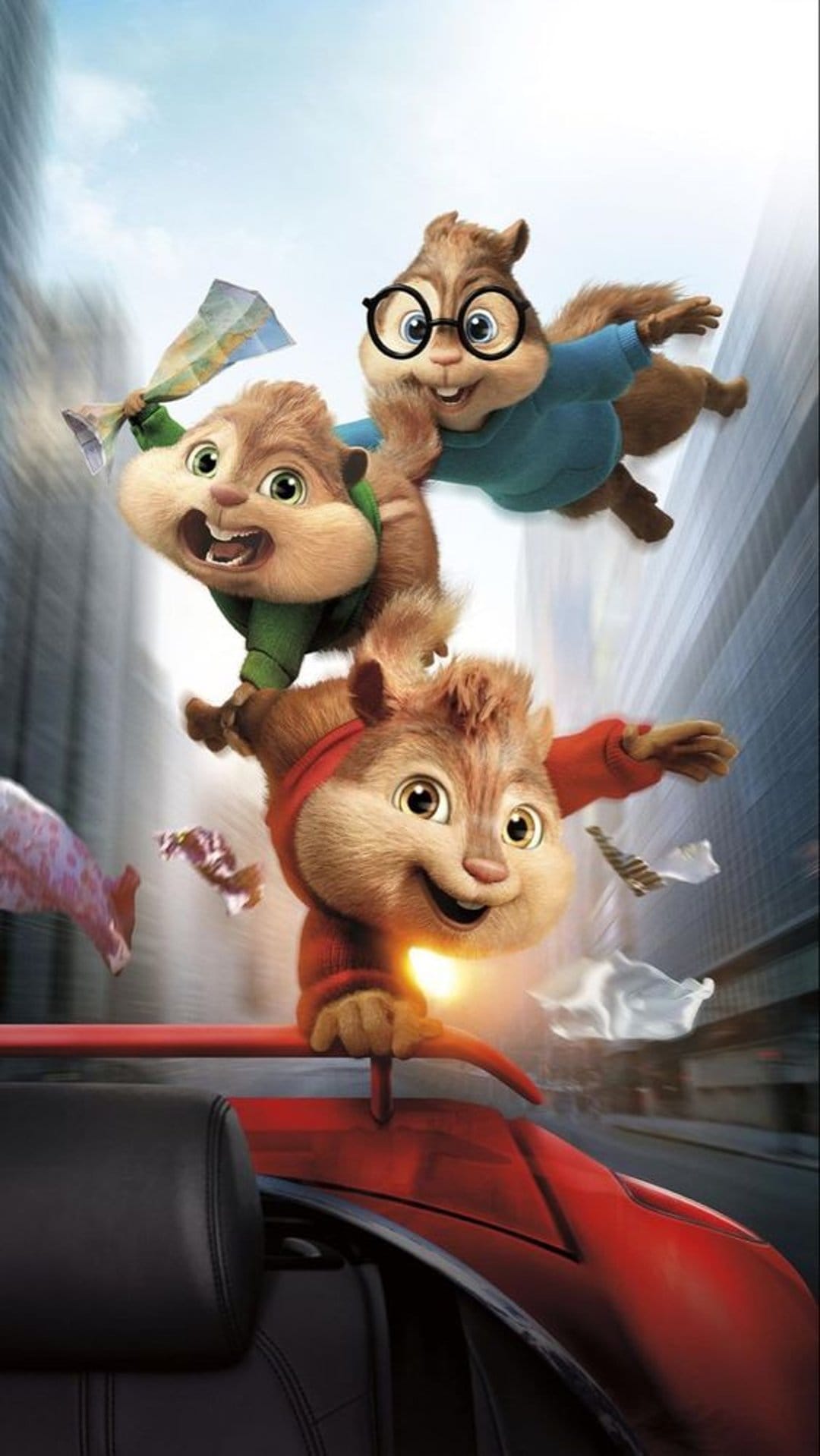 Alvin and the Chipmunks leap mid-air from a red car with maps flying against a blurred urban cityscape.