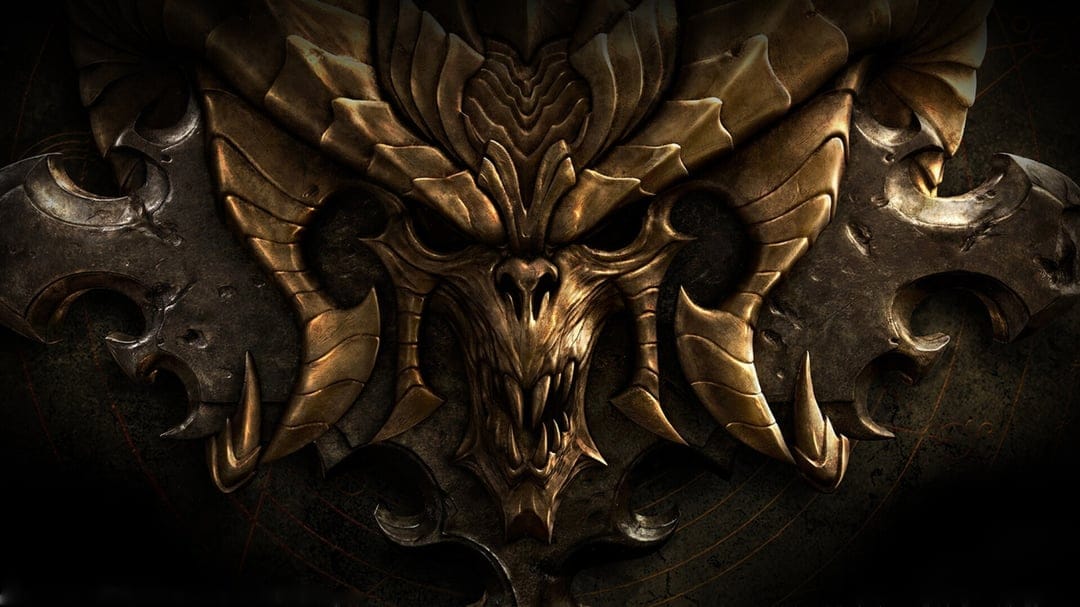 Gold demonic skull with massive curved horns and sharp fangs set against a dark weathered metal background.