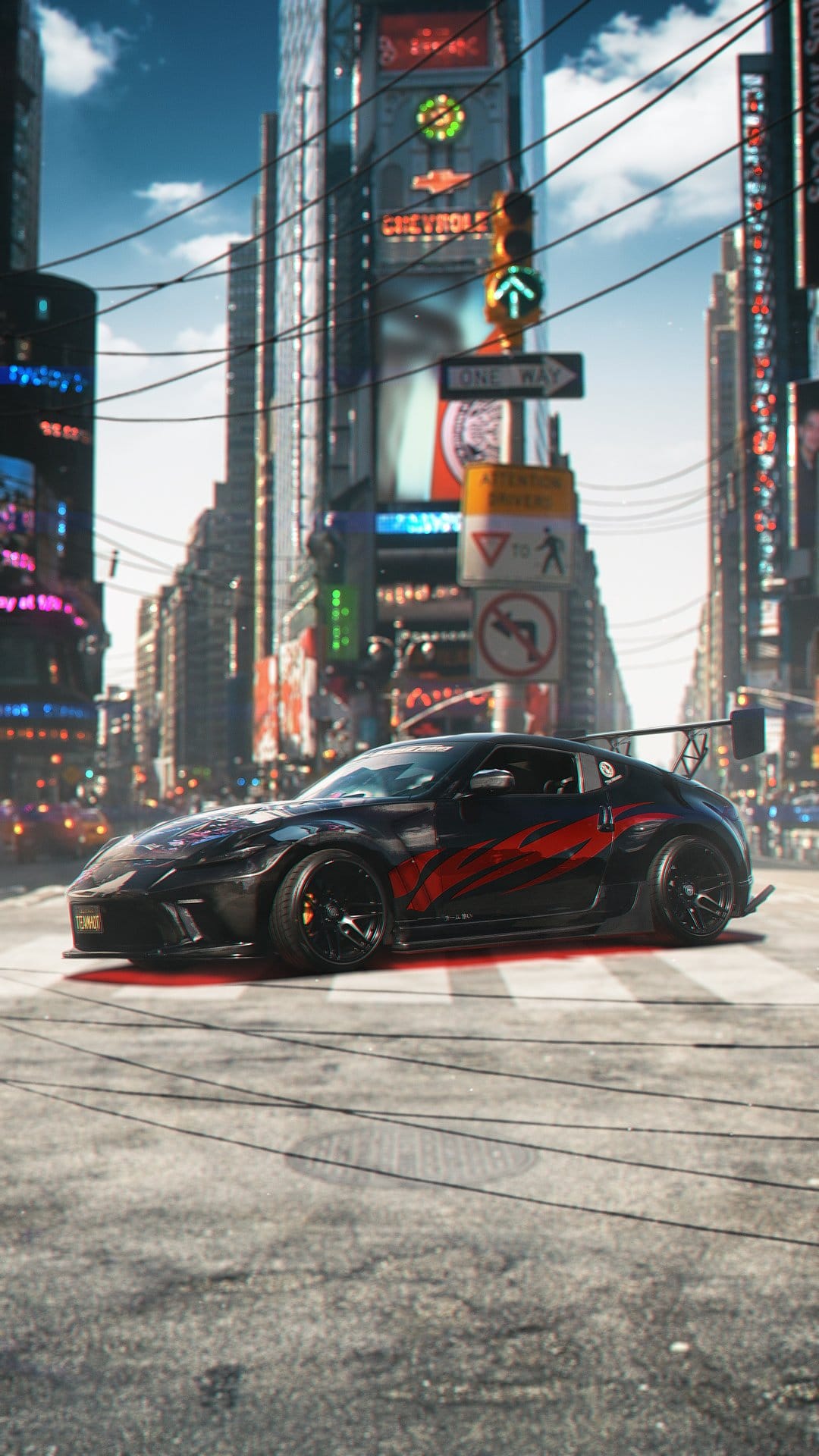 Nissan 370Z with red stripes drives through neon Times Square with digital billboards and overhead wires at night.