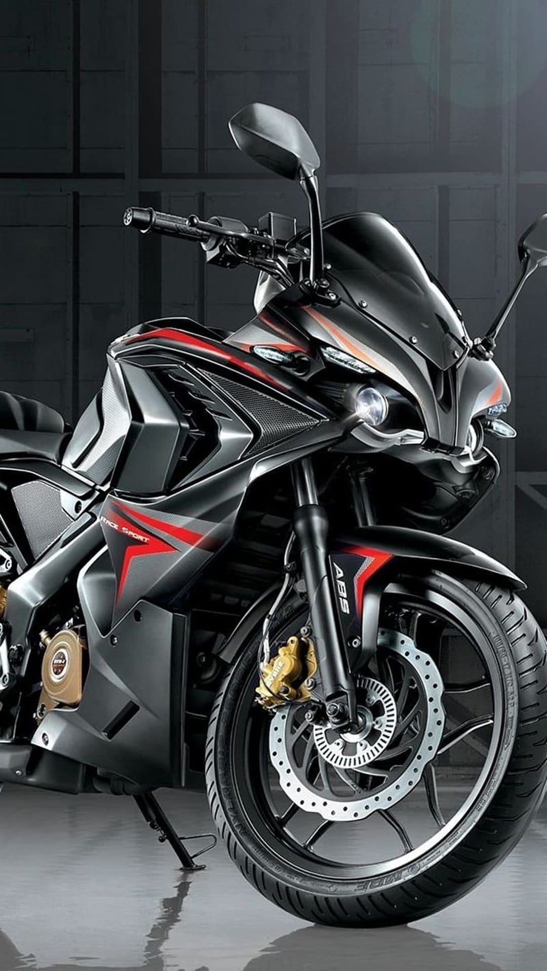 Sport motorcycle with matte black fairings and red accents features a projector headlight and disc brakes.
