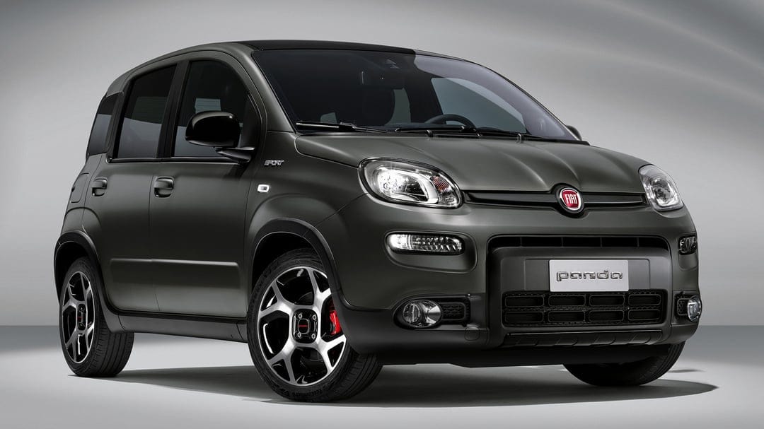 Matte grey Fiat Panda Sport with red brake calipers and black roof in a minimalist white studio environment.