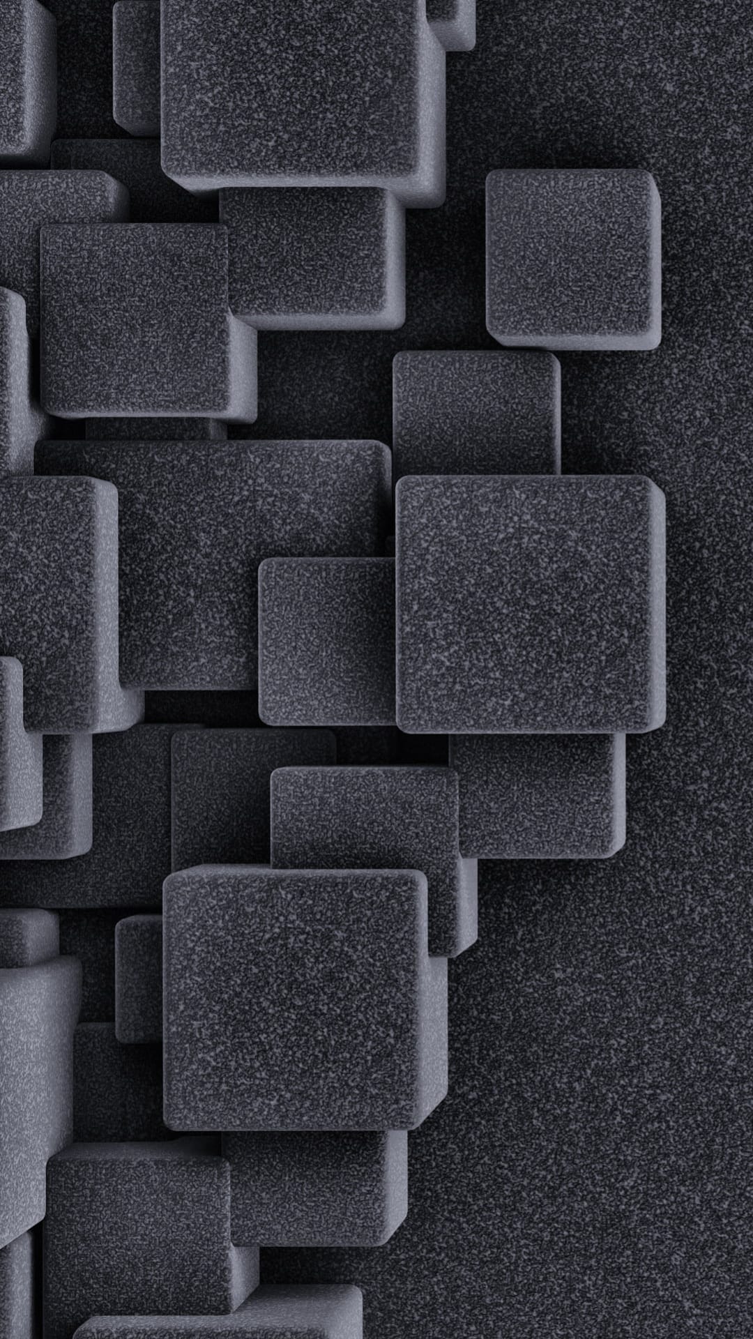 Charcoal grey 3D cubes with a grainy stone texture are arranged in a deep, shadowed geometric stack.