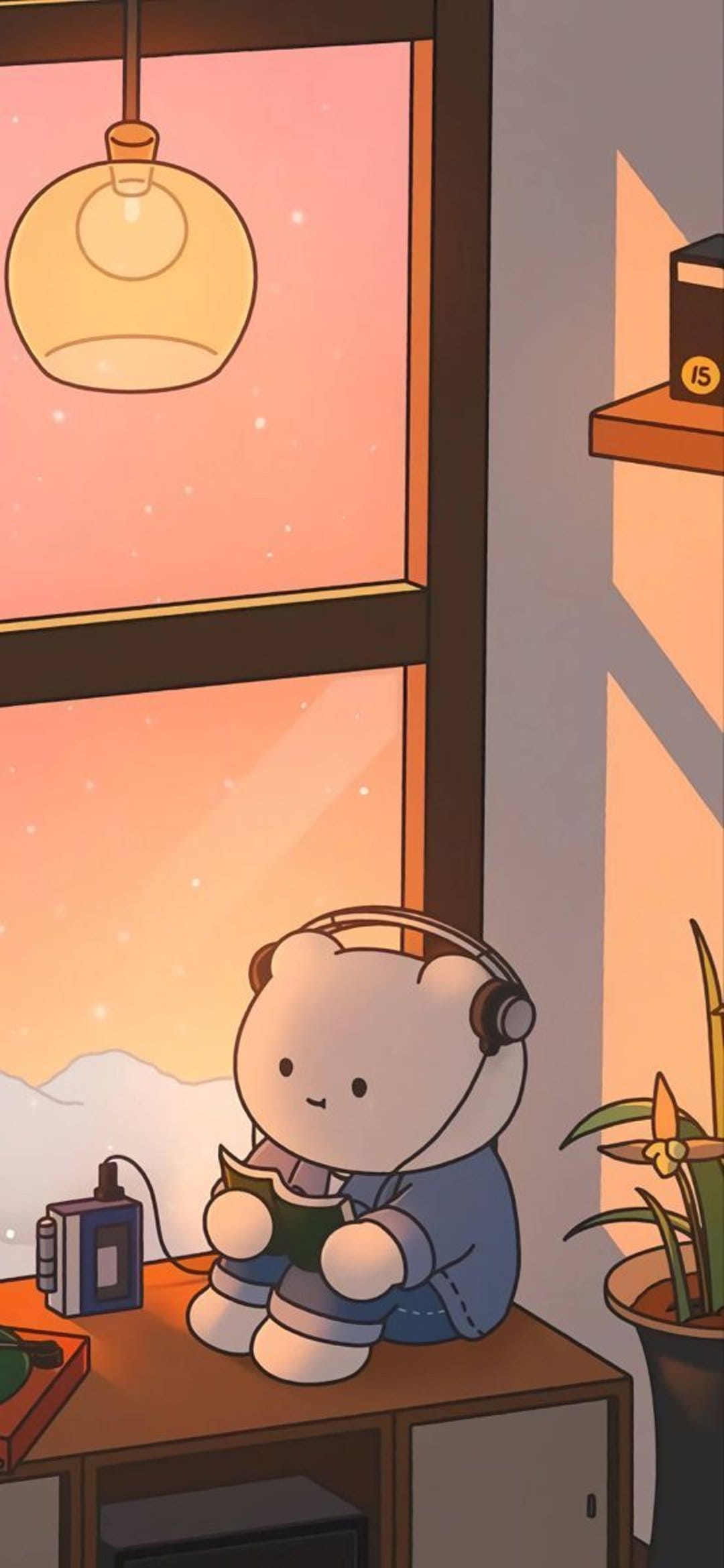 Brown bear wearing headphones sits at a desk reading a book by a snowy window during a golden sunset.