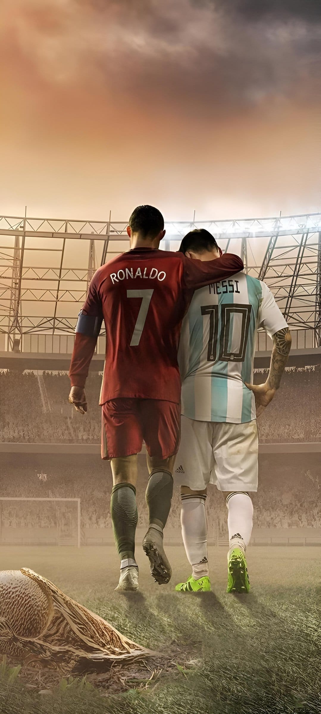 Cristiano Ronaldo and Lionel Messi walk on a grass field under a dramatic sky in a crowded football stadium.