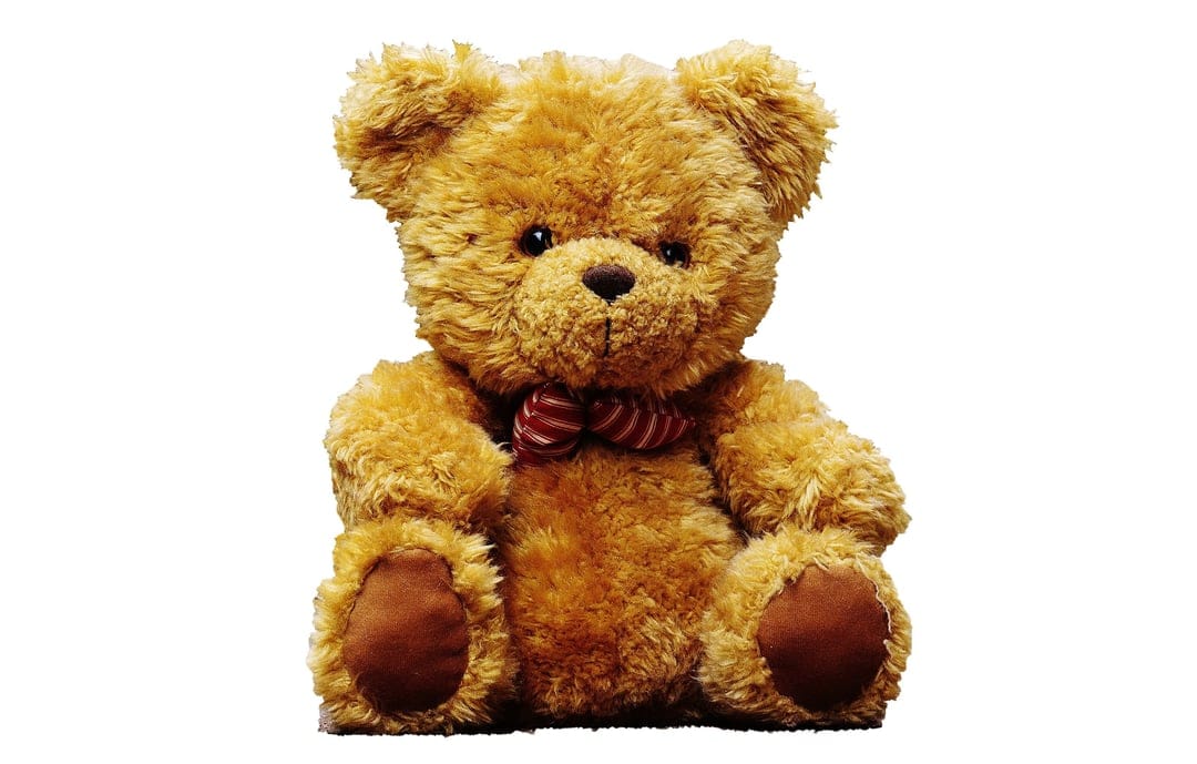Brown teddy bear with a red and white striped bow tie sits forward with fuzzy fur and dark button eyes.