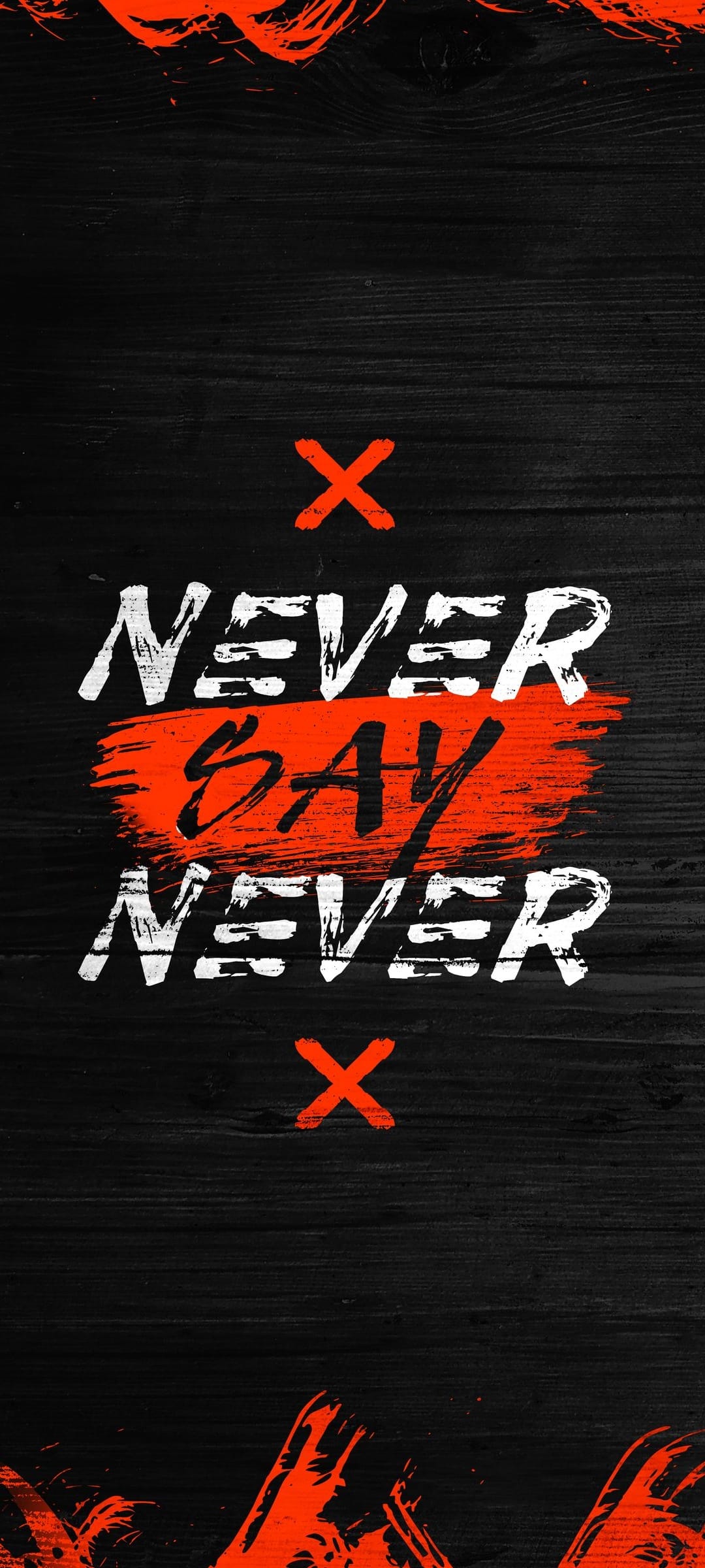 White Never Say Never quote over a red paint stroke on a dark textured wood surface with small red X marks.