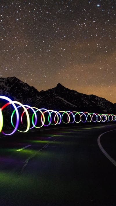 Light painting, stars, night sky, mountains, road, long exposure, colorful, abstract, art, creative, cosmic, nature, landscape, dark, galaxy, artistic, outdoors, illuminated, spiral, trails