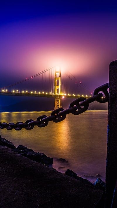 San Francisco, California, landmark, architecture, bay, foggy, illuminated, evening, scenic, travel, USA, engineering, iconic, serene, pacific, night photography, mist, structure, fort point, waterfront