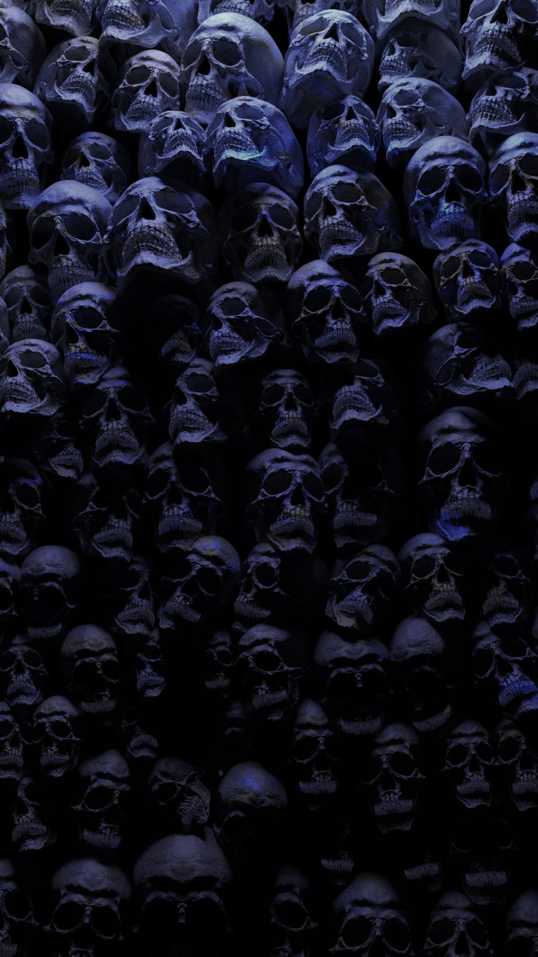 Human skulls packed together in a dense pile glow with a faint blue light against a deep black background.
