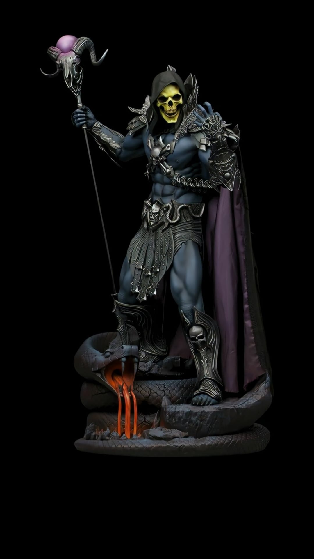 Skeletor statue holding a Havoc Staff on a stone snake base with orange lava flowing from its fanged mouth.