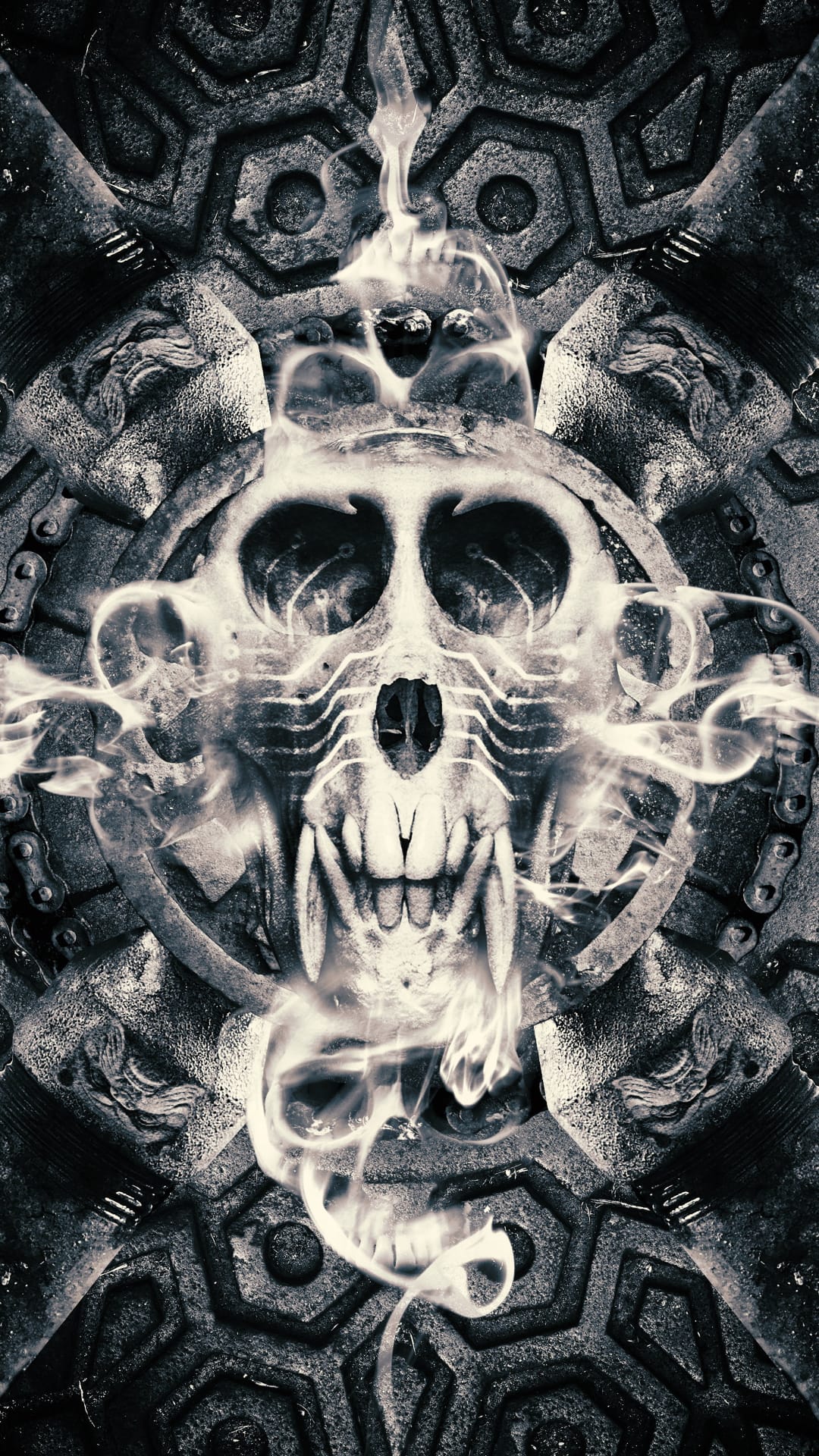 Gritty skull with mechanical eye sockets and sharp teeth emerges from swirling smoke amidst ornate chains.