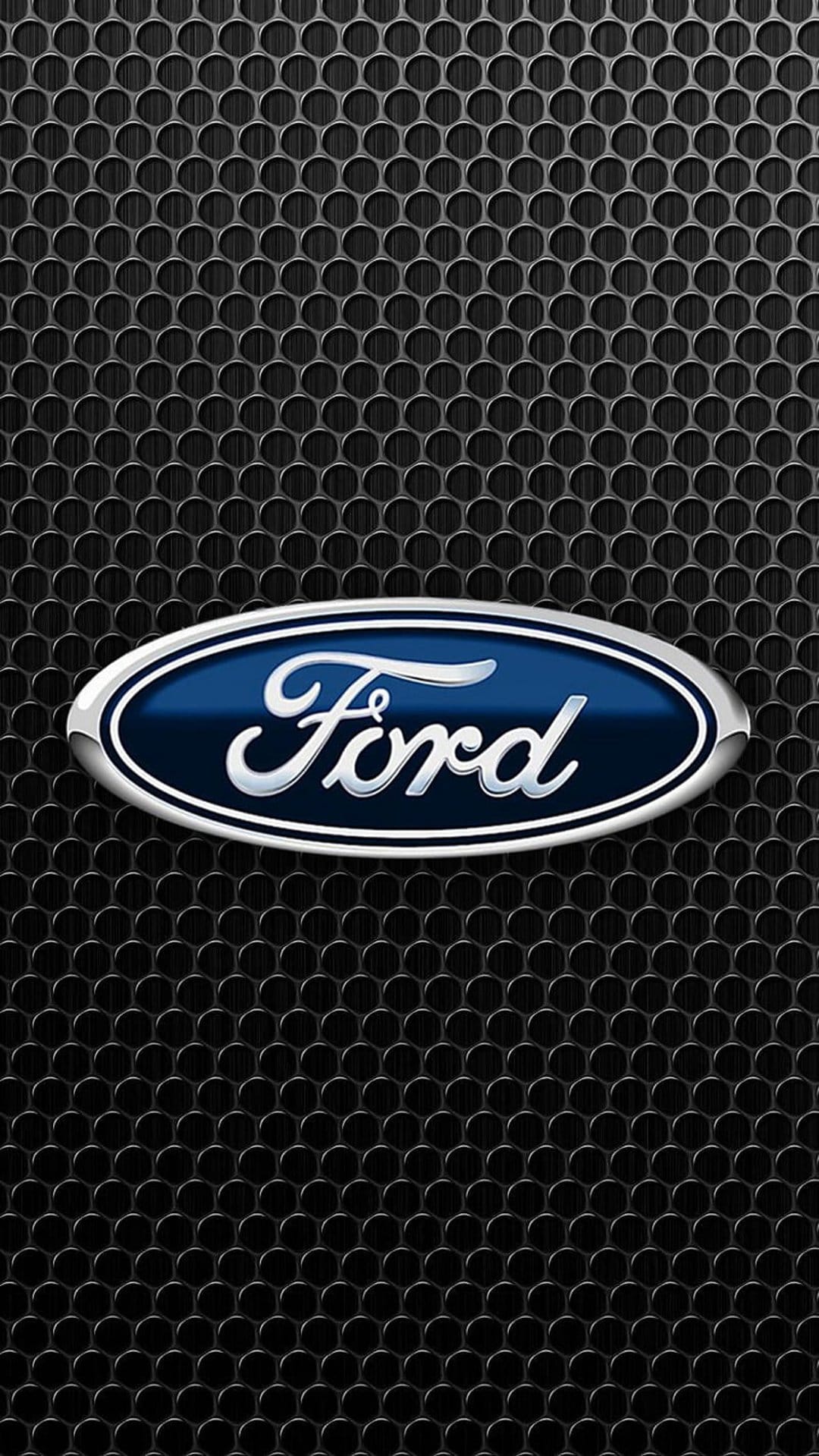 Ford blue oval logo and chrome script centered over a dark black hexagonal honeycomb metal mesh pattern.