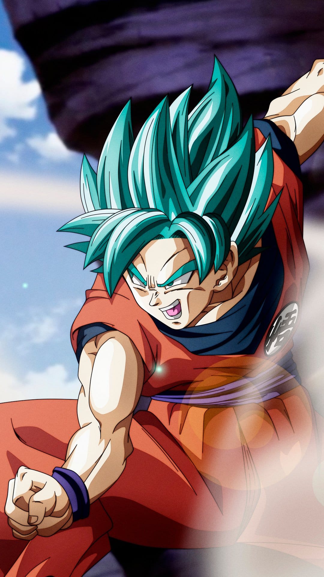Goku powers up with teal blue hair and a swirling energy aura in a dynamic fighting stance for a phone screen.