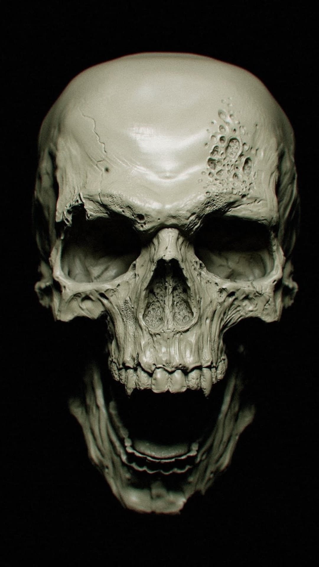 Weathered gray skull sculpture with a wide-open jaw and sharp fangs against a dark, minimalist background.