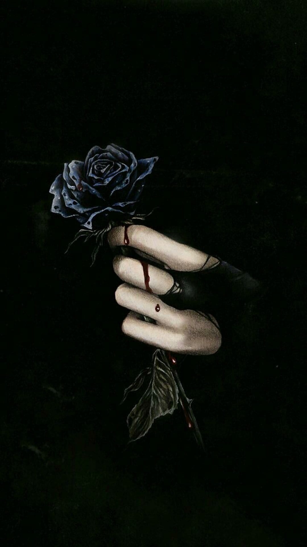 Gloved hand holds a blue rose with blood dripping from the stem and petals against a solid black background.
