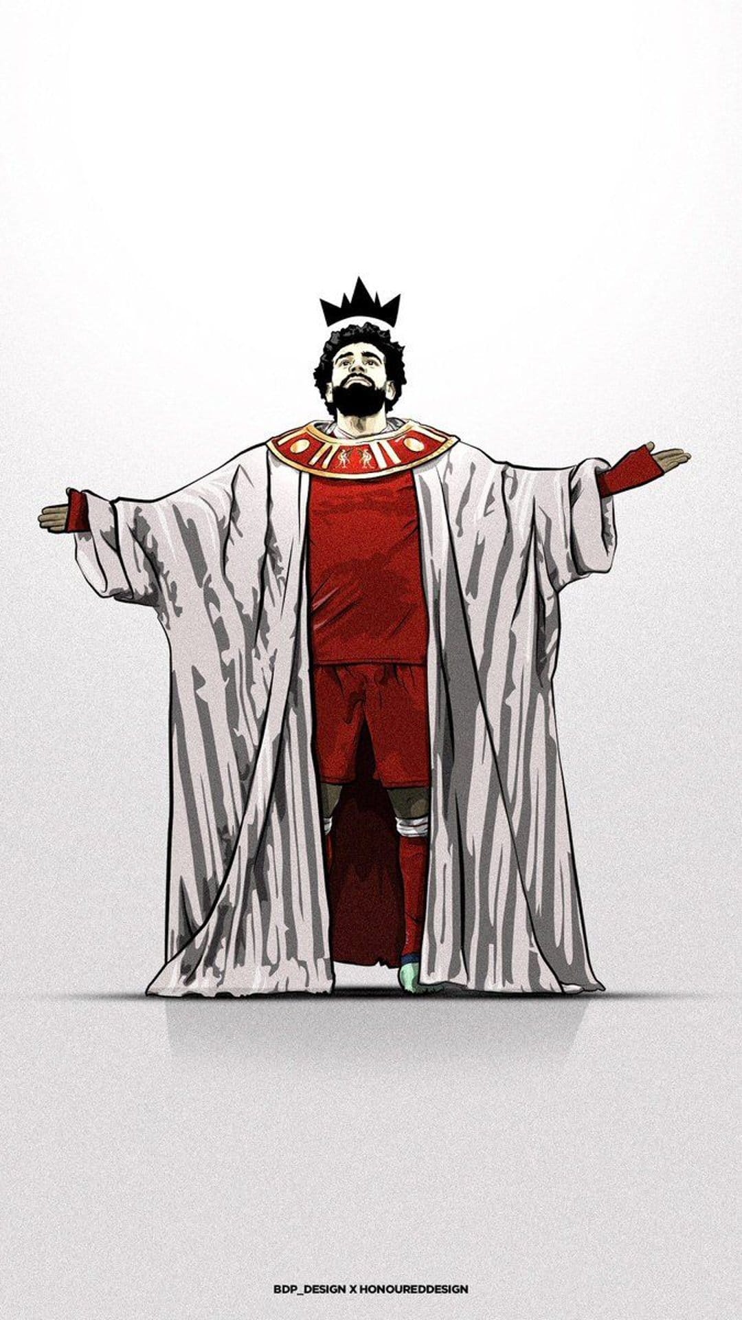 Mohamed Salah wears a gold-trimmed white pharaoh robe and crown over his red kit against a plain white background.