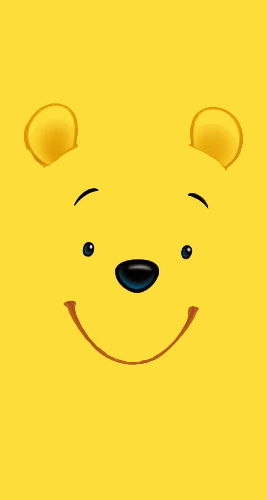 Winnie the Pooh's smiling face with black eyes and a small nose centered on a solid vibrant yellow background.