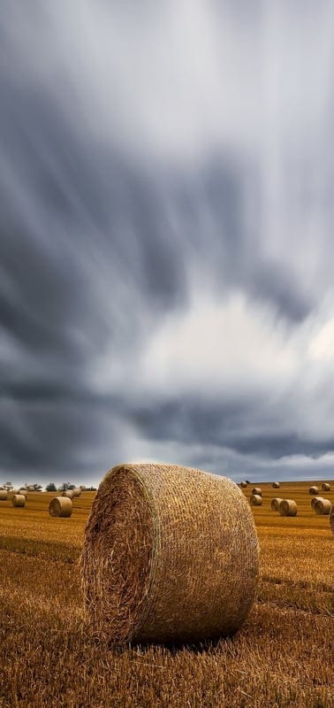 Hay bales, field, nature, landscape, peaceful, serene, tranquil, beautiful, outdoor, golden, harvest, clouds, sky, dramatic, rural, farm, agriculture, tranquil scene, vast, dynamic