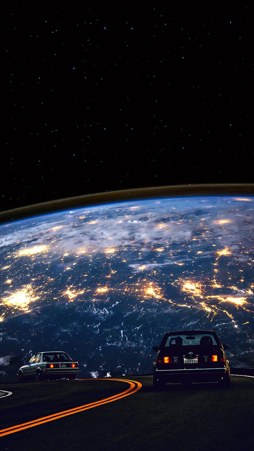Two cars parked on a road with orange lines overlook the glowing lights of Earth from a starry orbital vantage.