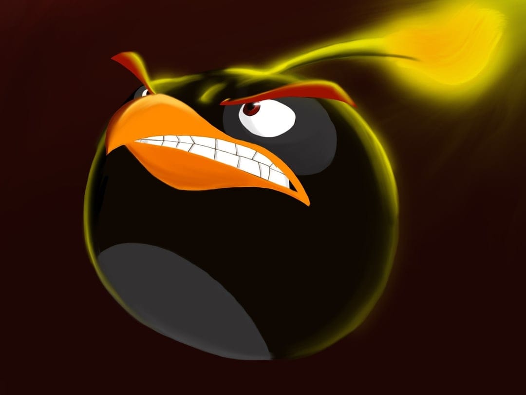 Black cartoon bird with a glowing yellow fuse, bared teeth, and intense red eyes against a dark background.