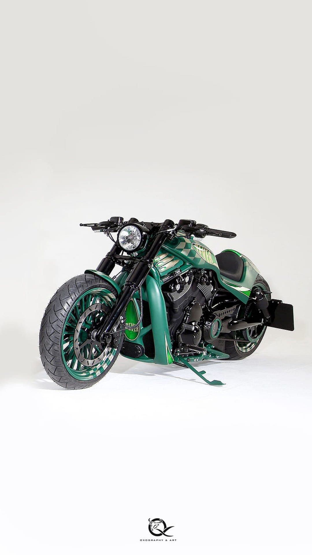 Custom Harley Davidson motorcycle with emerald green paint and checkered patterns against a white background.