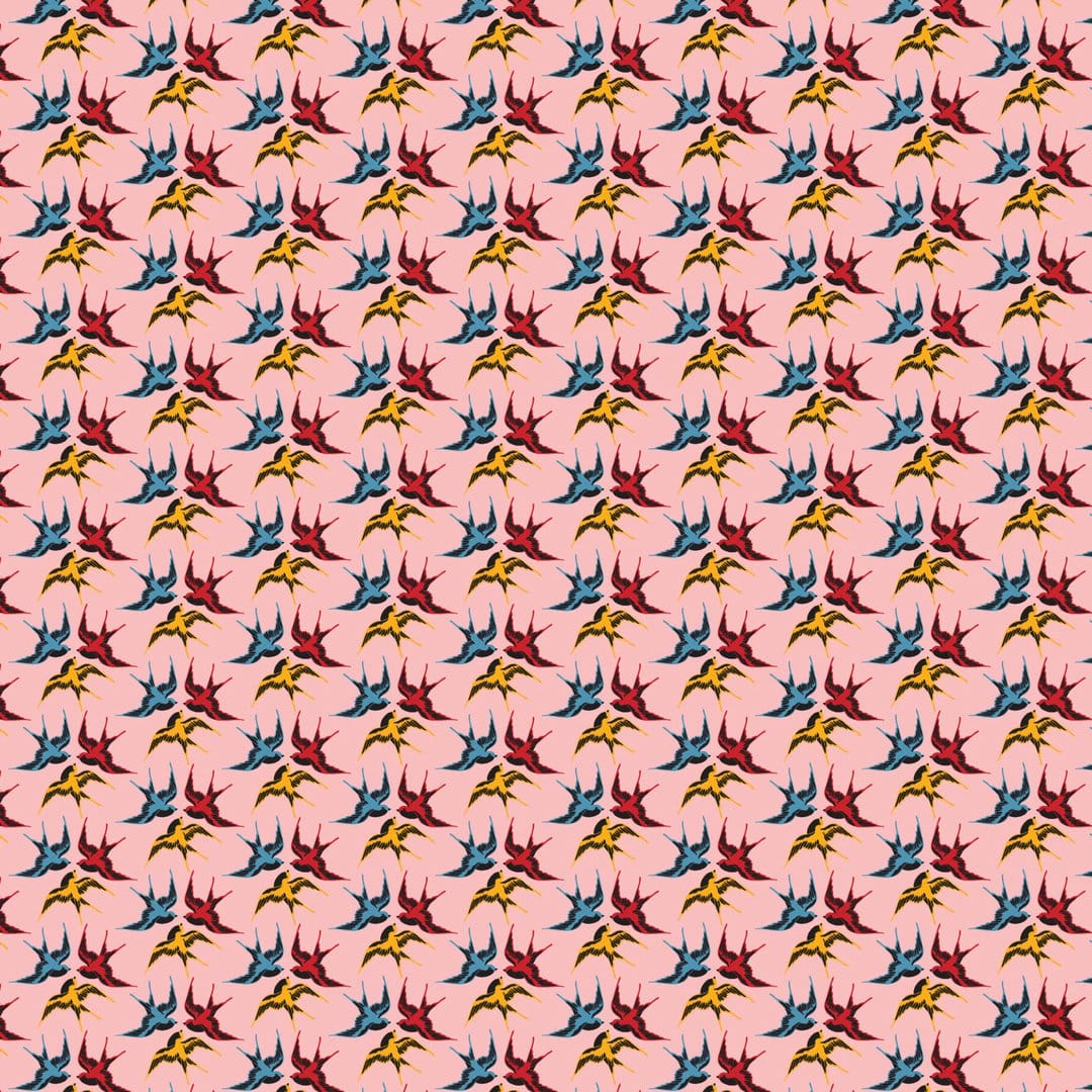 Stylized red, yellow, and blue swallows fly in a repeating pattern across a soft pastel pink background.