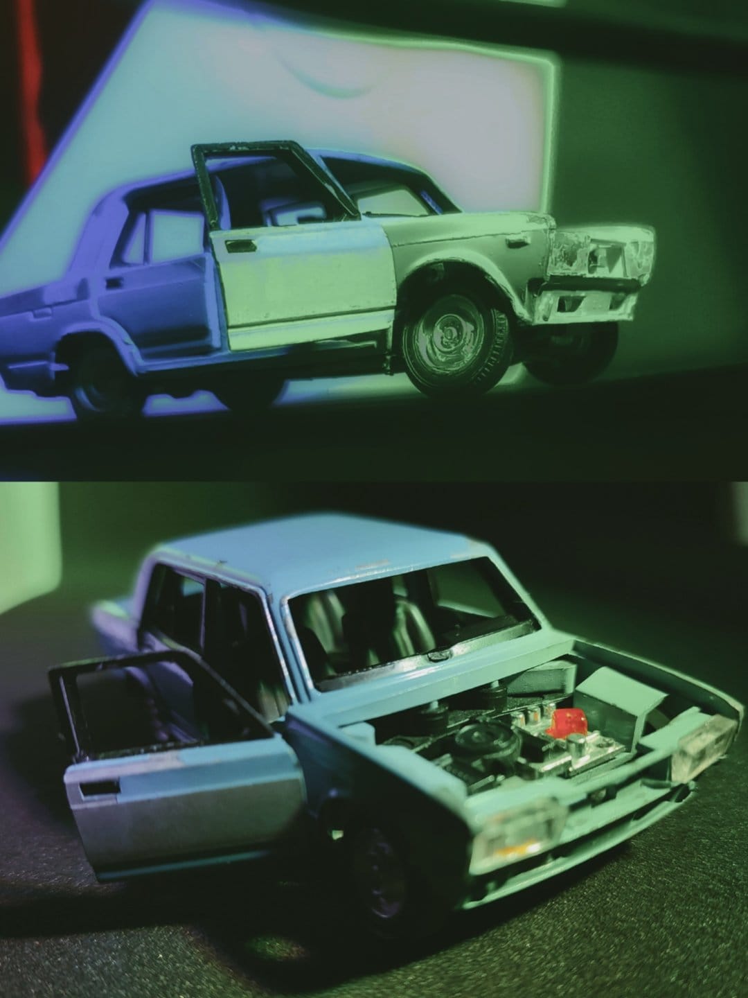 Light blue model car with an open hood and driver door features detailed engine components under teal lighting.