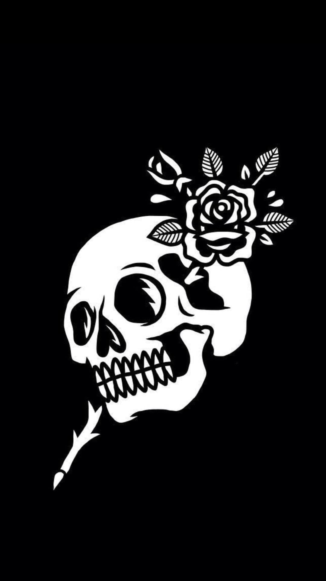 White skull profile integrated with a blossoming rose and thorny stem against a solid black background.