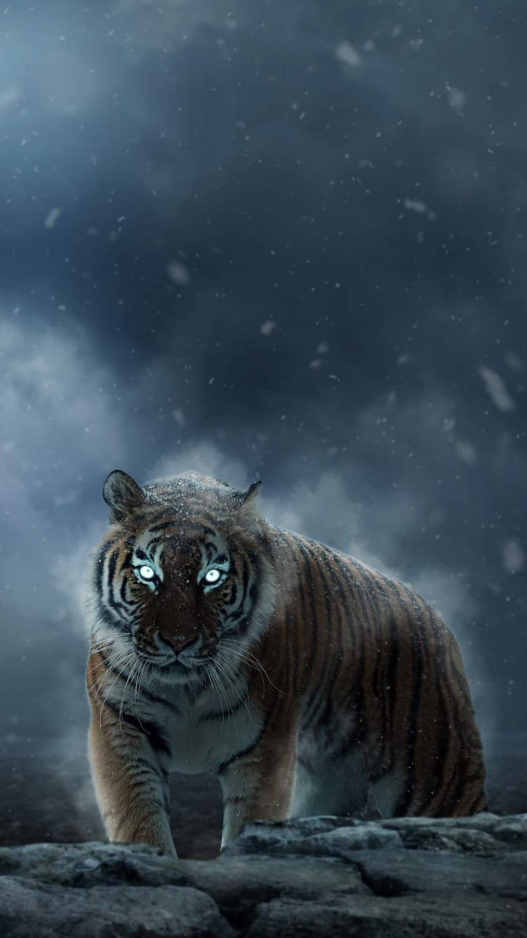 Tiger with glowing blue eyes and snow-covered fur stands under a dark stormy sky during a heavy winter blizzard.