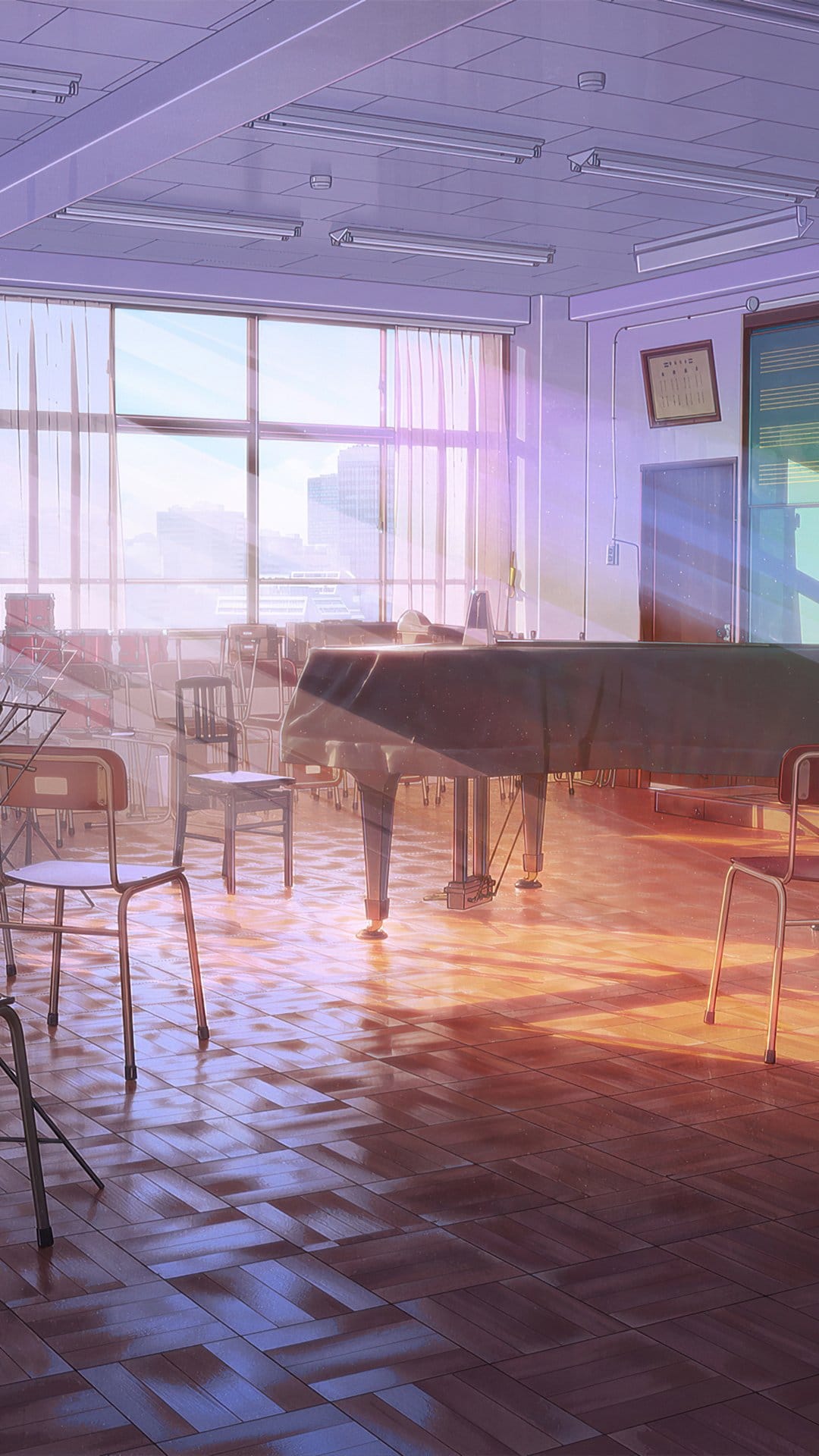 Grand piano and chairs in a music classroom bathed in warm sunset light streaming through large windows.