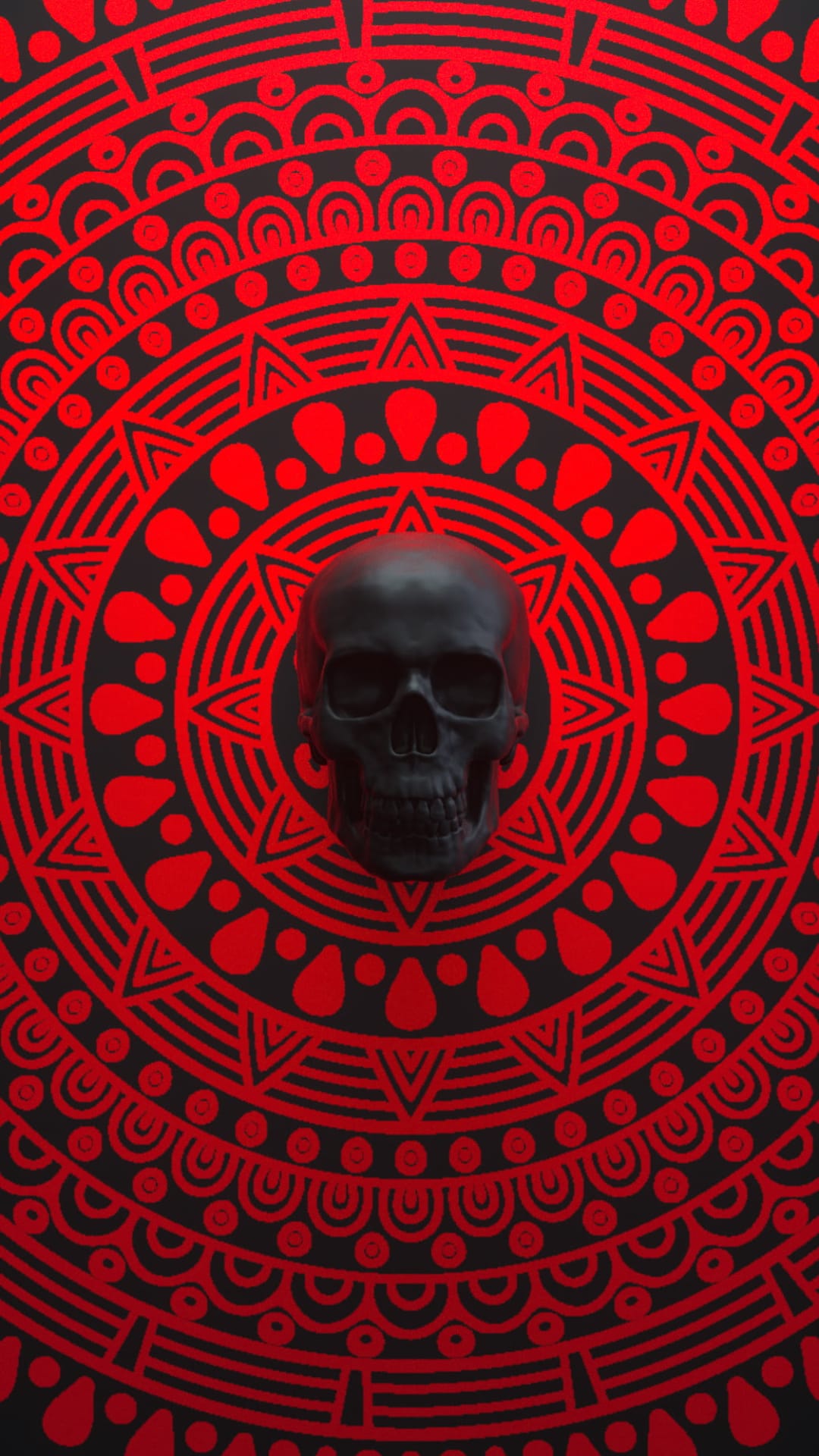 Human skull with a matte black finish centered over a symmetrical red and black mandala pattern with dots.