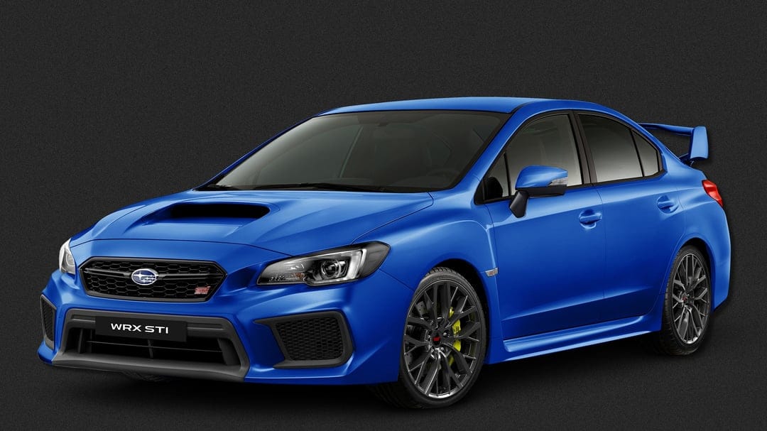 Blue Subaru WRX STI sports sedan with a large rear wing and yellow calipers on a dark textured background.