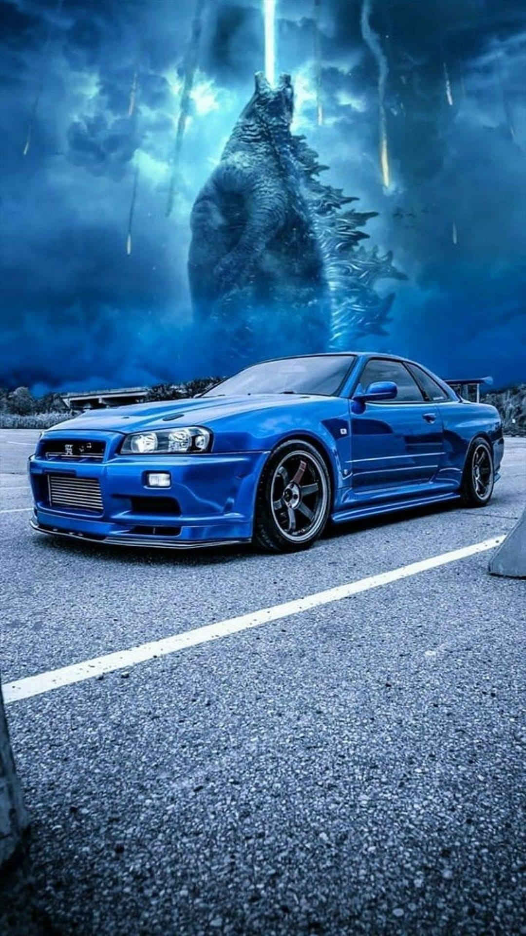 Nissan Skyline GT-R parked on asphalt as Godzilla breathes blue fire under a meteor shower in a dark sky.