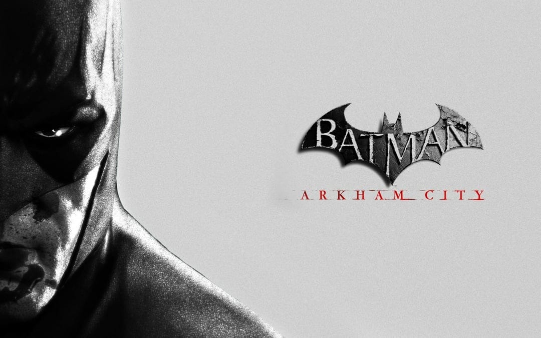 Close-up of Batman in a dark cowl next to the Arkham City logo on a textured gray background.