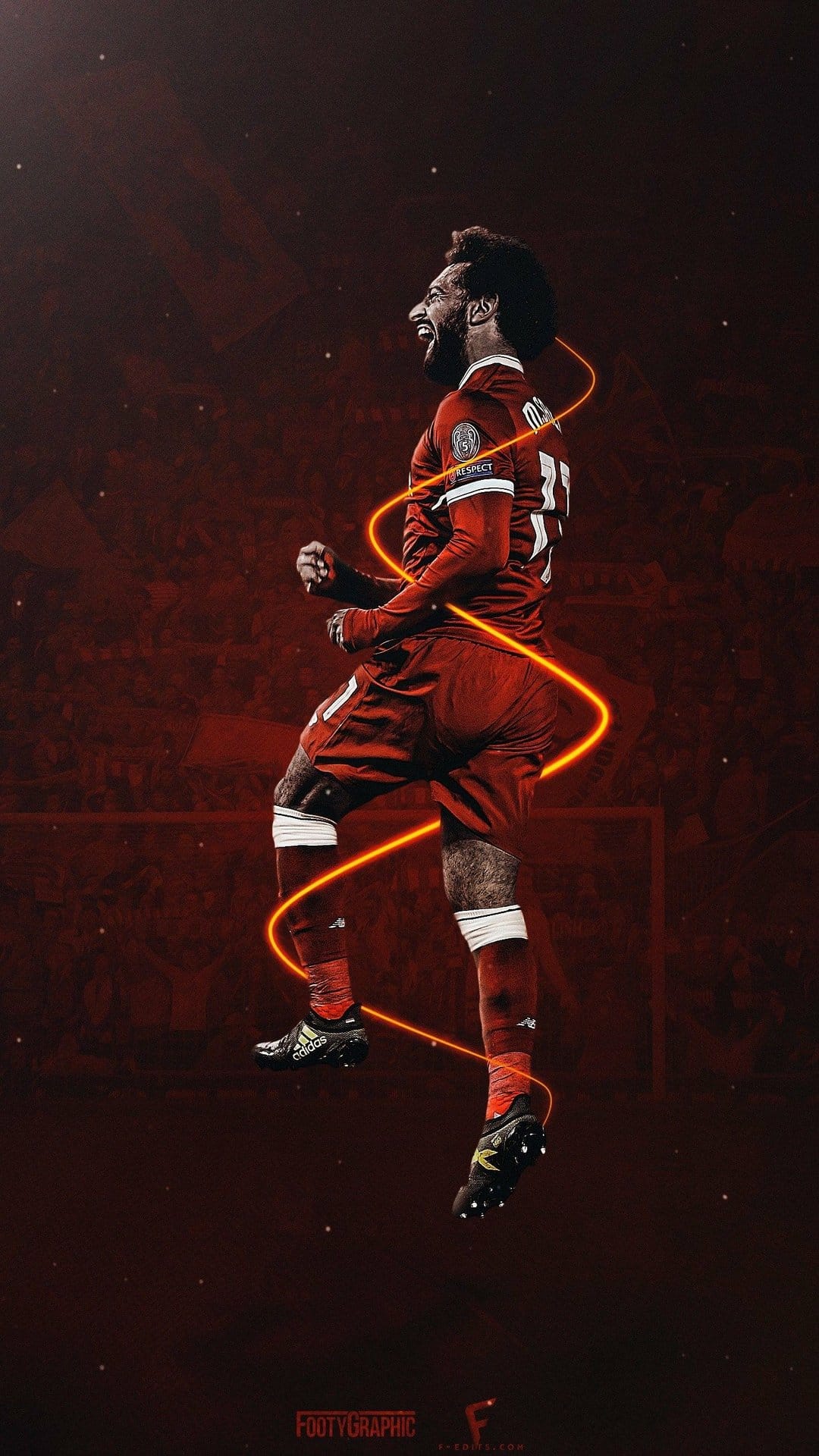 Mohamed Salah jumps in mid-air wearing a red jersey with number eleven surrounded by orange light trails.