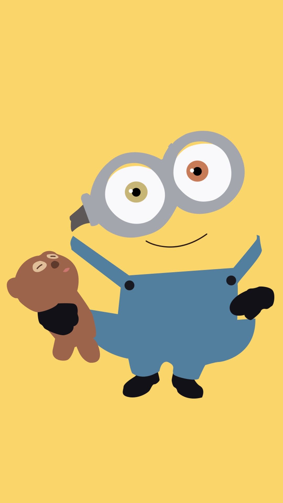 Minion with goggles and blue overalls hugging a small brown teddy bear against a solid bright yellow background.
