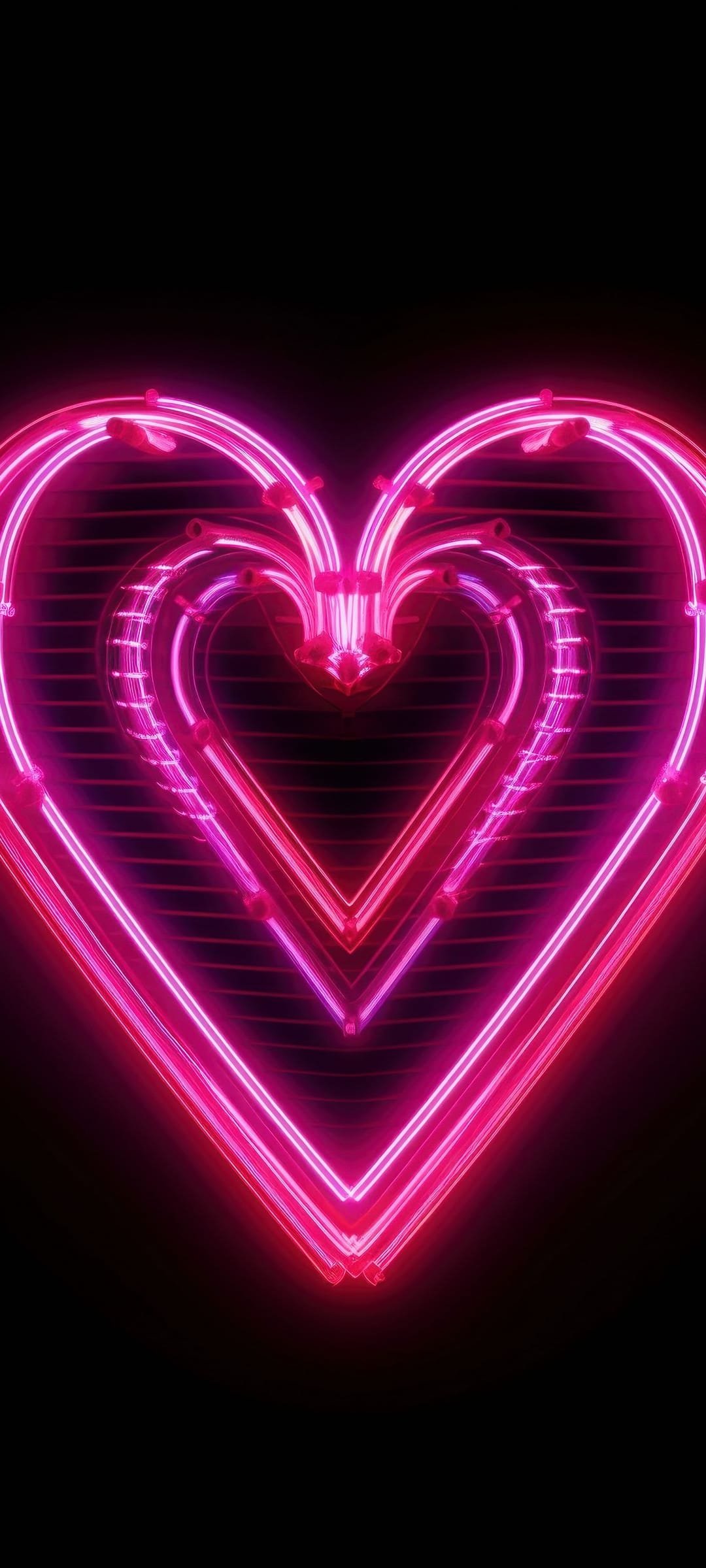Two glowing magenta neon hearts with a ribbed texture are nested together against a dark black background.