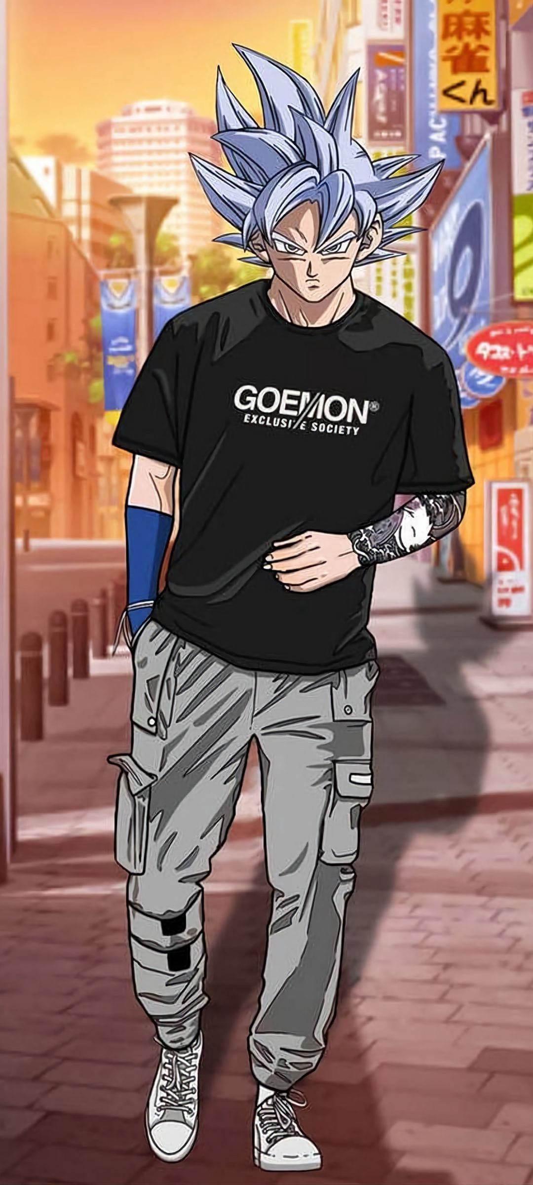 Goku stands in grey cargo pants and a black t-shirt against a neon city backdrop with tattoos on his arms.