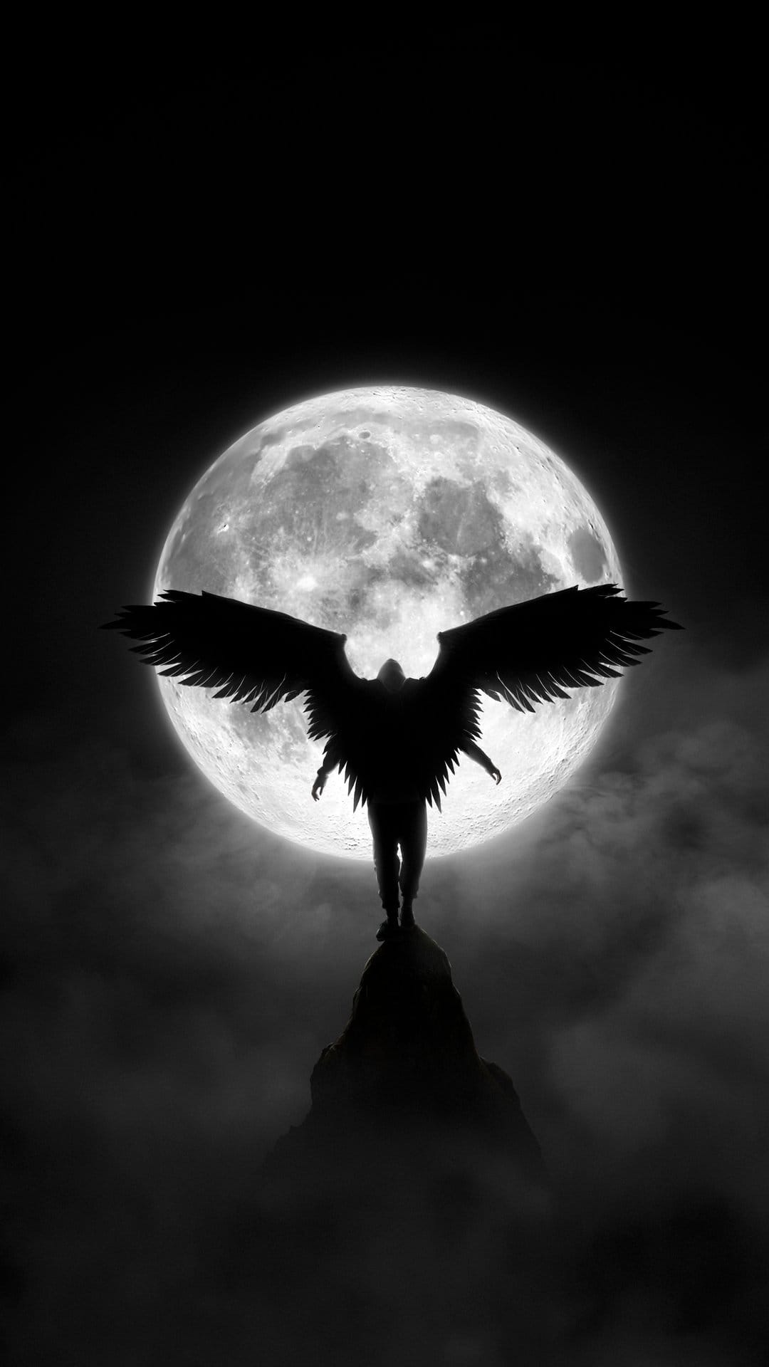 Winged silhouette stands on a mountain peak under a large full moon surrounded by wispy clouds and night sky.