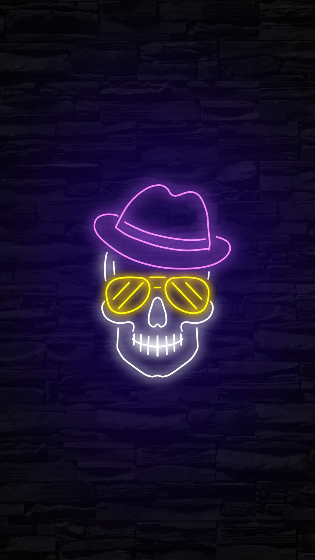 Neon skull wearing a purple fedora and yellow aviator sunglasses glowing against a dark, textured brick wall.